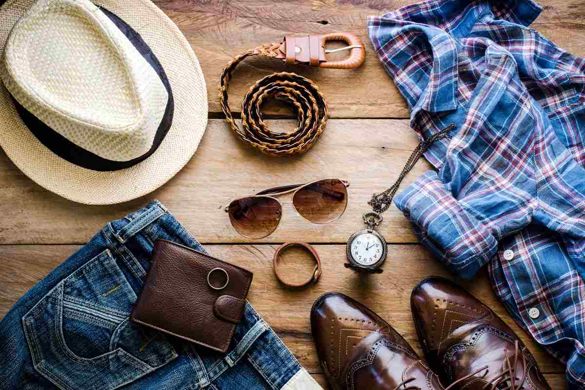 Men's casual outfit and accessories for travel.